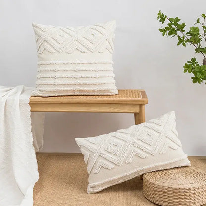Cream-colored geometric tufted pillow covers with textured patterns and frayed edges in soft woven fabric for decorbites decor