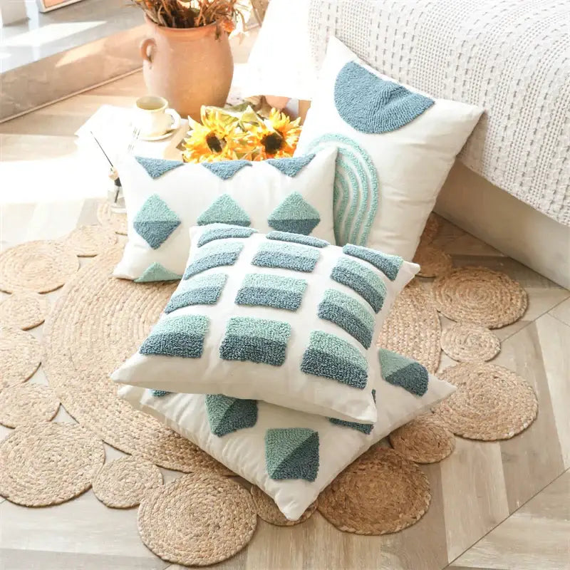 White throw pillow cover with teal geometric tufted diamond pattern for living room decor by decorbites
