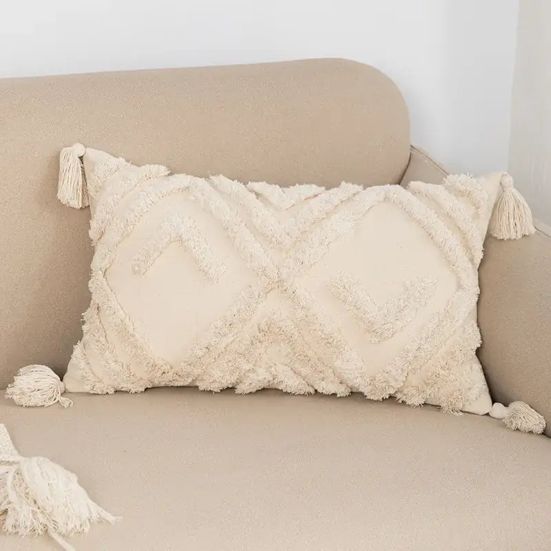 Cream-colored geometric tufted fringed cushion cover with textured fabric and tassels for living room decorbites pillow