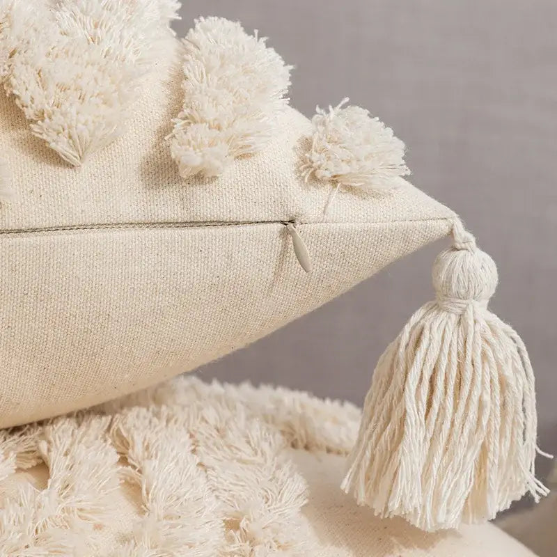 Cream-colored linen geometric tufted fringed cushion cover with fluffy pom-poms and tassel for living room decorbites decor