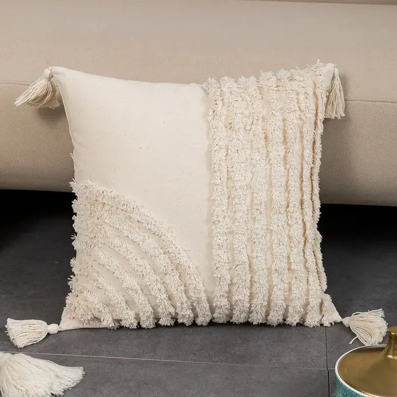 Cream-colored geometric tufted fringed cushion cover with textured fabric and decorative tassels for living room decorbites decor