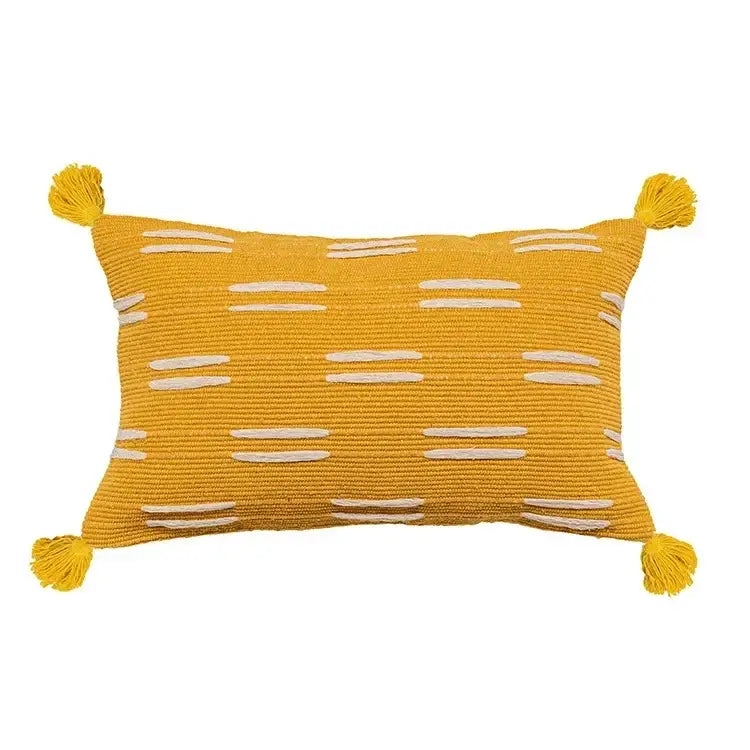Vibrant yellow cushion cover with white embroidered horizontal stripes and geometric tufted tassel accents for living room decor