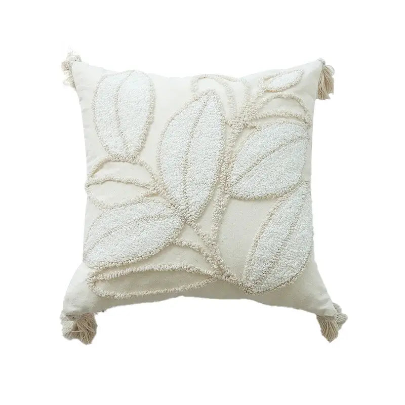 Cream-colored geometric tufted tassel cushion cover with textured leaf embroidery and tassels for living room decor