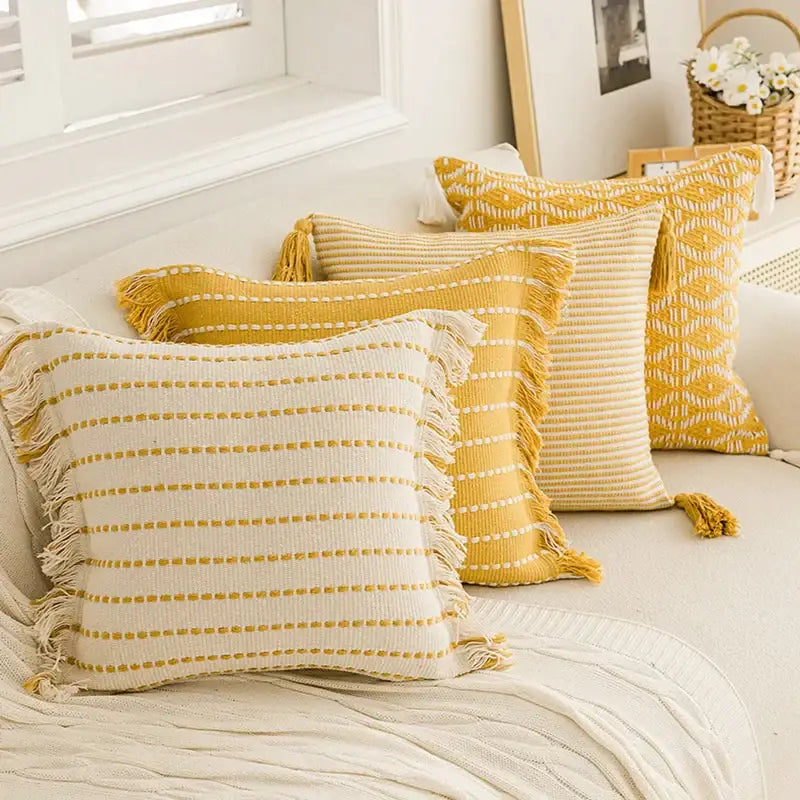 Yellow and cream striped geometric tufted cushion cover with crochet tassels and fringed edges for living room decorbites