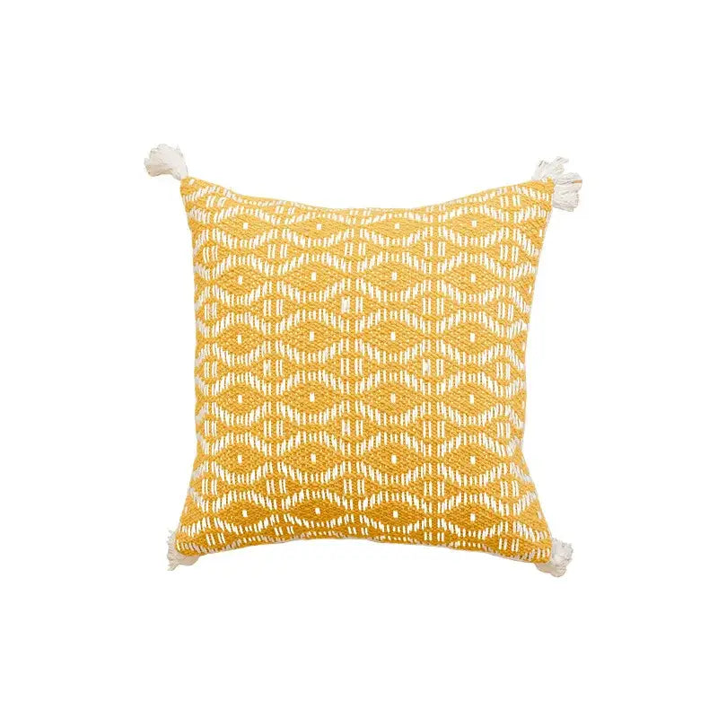 Yellow square cushion cover with white woven geometric pattern and crochet tassels by decorbites for living room decor