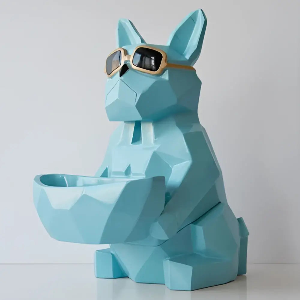 Geometric turquoise french bulldog tissue box holder in light blue with gold-rimmed sunglasses and matching bowl holder