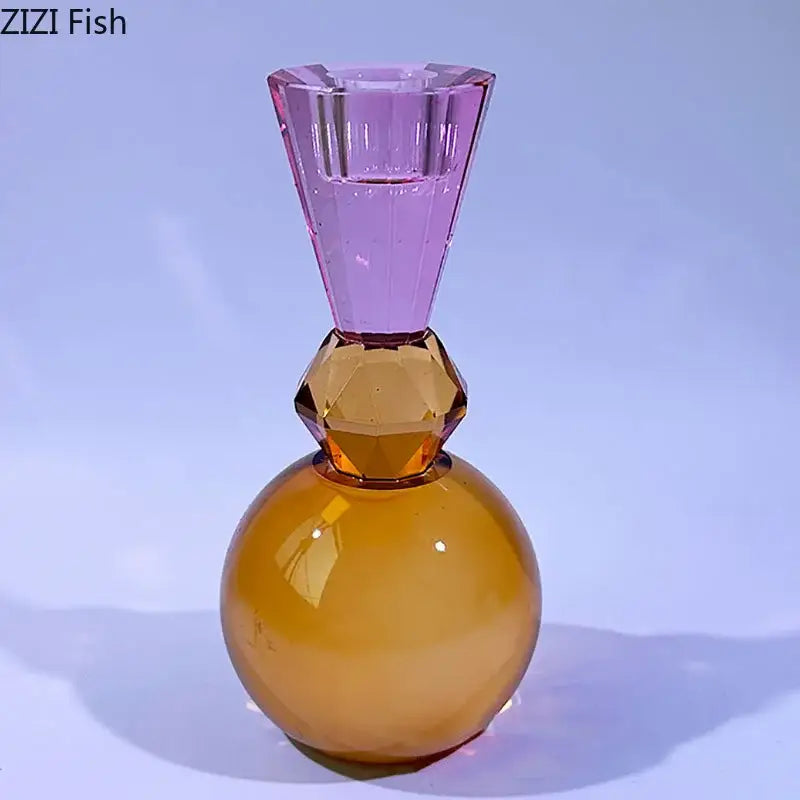 Faceted two-toned glass crystal candle holder with purple and amber sections for vibrant dining room decor