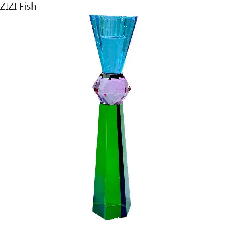 A vibrant multi-colored crystal candle holder with a faceted purple gemstone center and green tapered base for dining room use