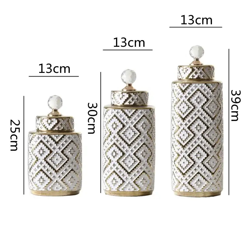 Set of three white ceramic decorative jars with golden relief diamond patterns and clear crystal knobs by decorbites geometric golden