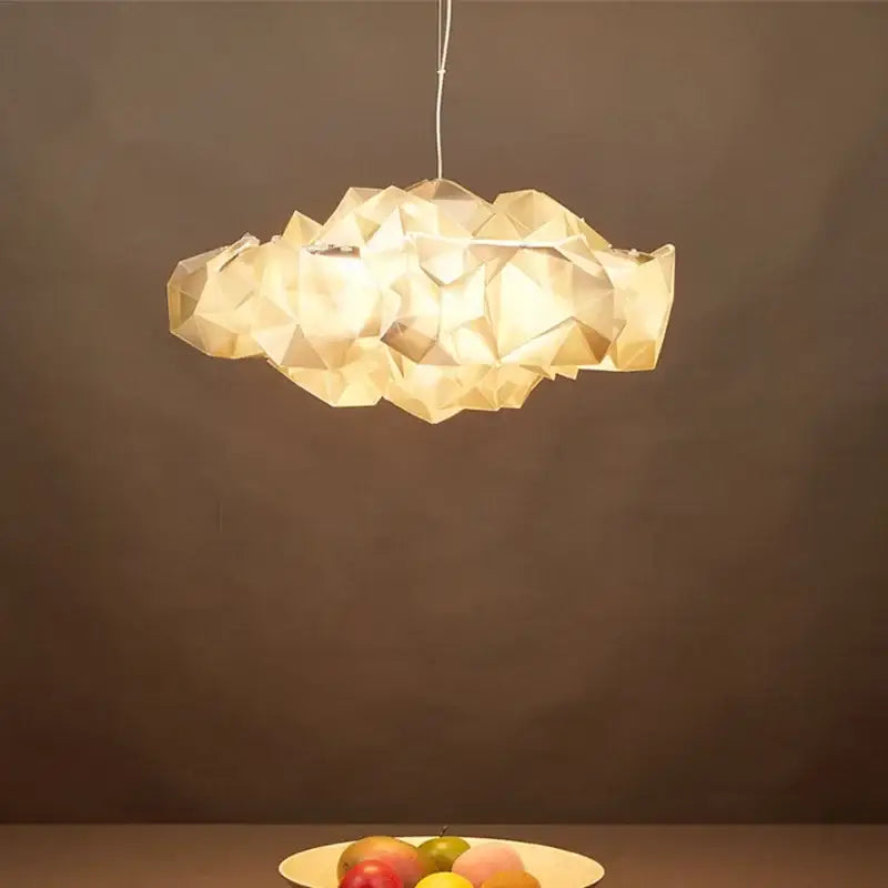 Geometric faceted pendant light with warm golden hue and translucent paper material for decorbites clouds white gold