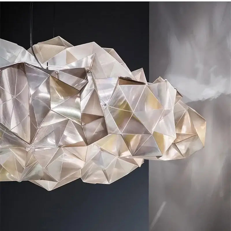 A modern geometric pendant light with faceted cloud-like design in silver and gold decorbites clouds white gold material