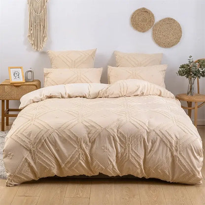 Beige quilted duvet cover with geometric embroidery pattern as part of a geometric white quilted duvet cover set