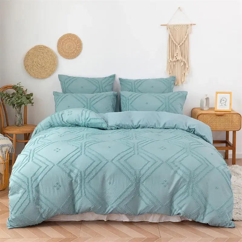 Teal-colored quilted duvet cover set with geometric embroidery pattern for bedroom bedding cover set