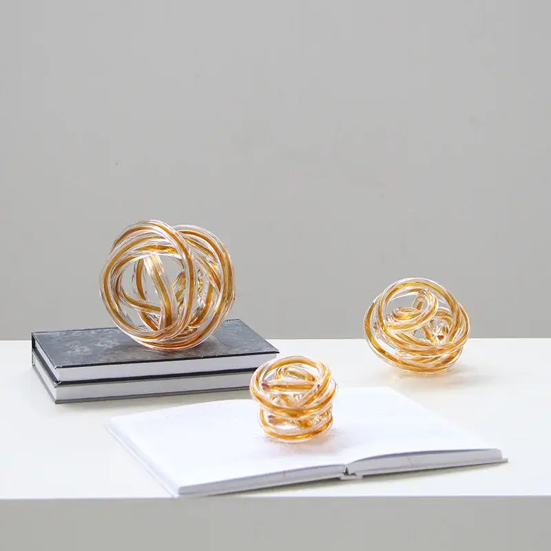Golden glass geometric wound twine sphere with amber and clear strands for decorbites living room decor