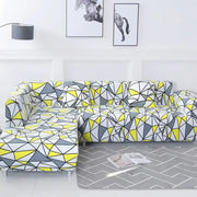 Vibrant geometric stretch sofa cover in bold yellow gray and white tones by decorbites for living room couch protection