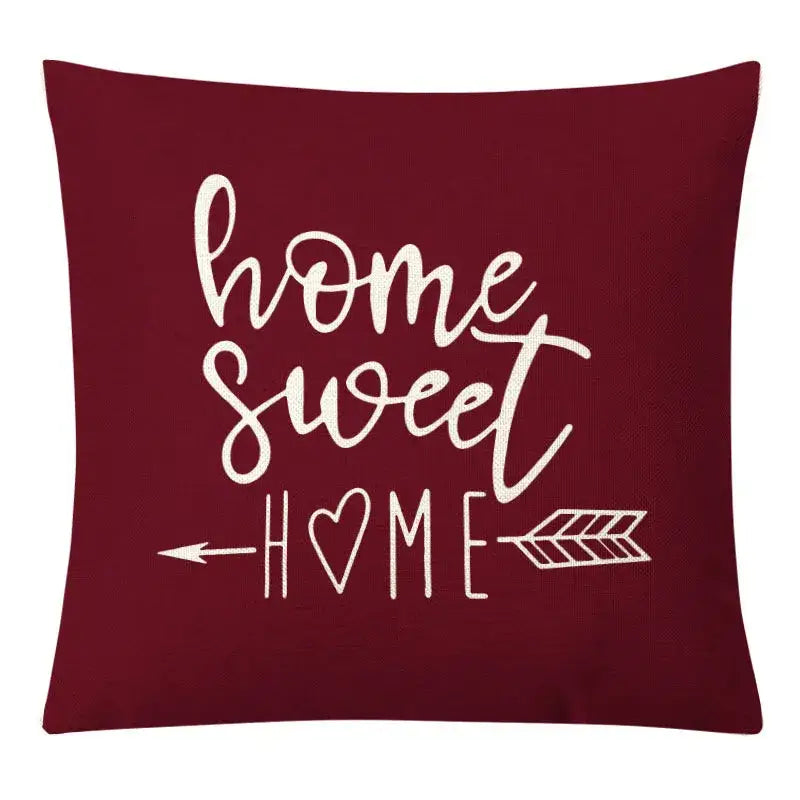 Maroon pillow cover with home sweet home white cursive script and arrow design complementing decorbites geometric yellow linen set