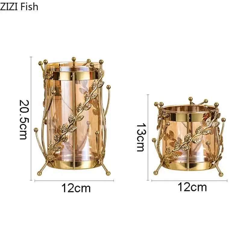 Gold-toned metal candle holders with intricate leaf and vine design and clear glass inserts for gilded tree branch centerpiece