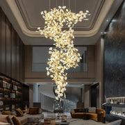Ginkgo biloba chandelier gold glass pendant light with cascading leaf-shaped elements emitting a warm glow for living room decorbites