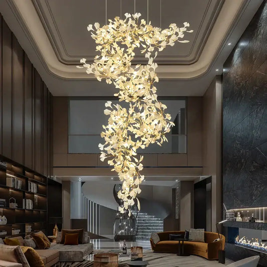 Ginkgo biloba chandelier gold glass pendant light with cascading leaf-shaped elements emitting a warm glow for living room decorbites