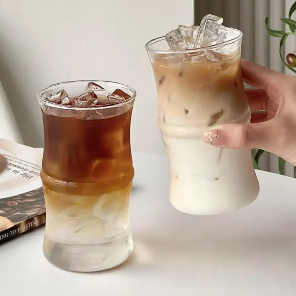 Clear glass bamboo knot mug with bamboo-inspired design filled with iced coffee and ice cubes for kitchen use