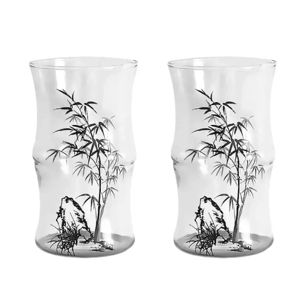 Clear glass bamboo knot mug with black ink bamboo and rock illustrations for kitchen coffee use