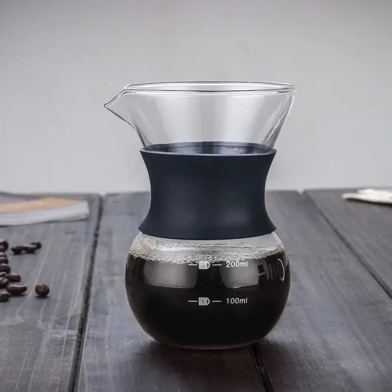 Clear glass coffee pot with matte black silicone handle and stainless steel filter with 100ml and 200ml markings