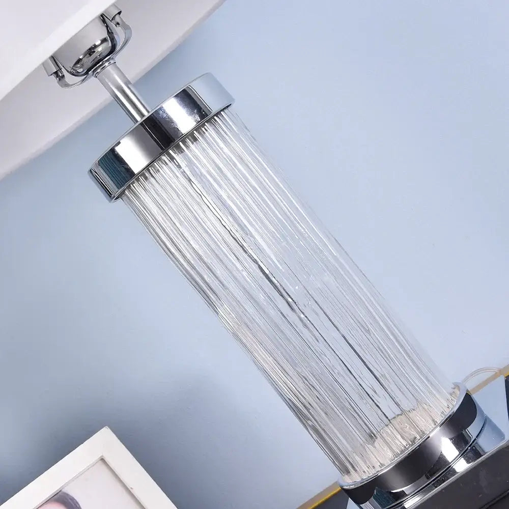 Chrome finished glass crystal cylinder table lamp with clear ribbed glass shade for bedroom use