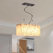 Rectangular pendant light with warm bamboo shade and black hardware in a decorbites beige glass island pendant design