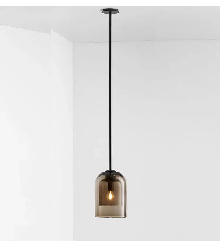 A sleek black glass led chandelier with smoked glass dome and exposed bulbs for dining room pendant lighting