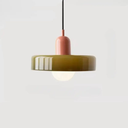 A glass pendant lighting bauhaus style featuring a matte olive-green shade and soft pink stem suspended by a black cord