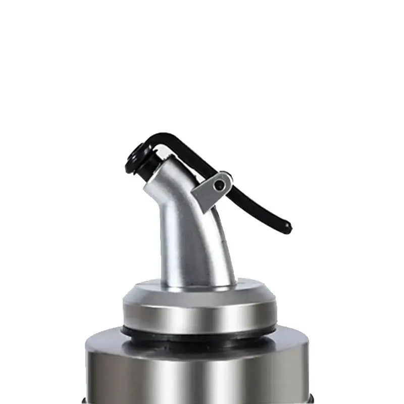 Silver metallic spray nozzle with black lever handle on glass seasoning dispenser bottle with stainless spout