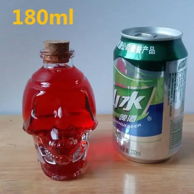 Transparent glass skull bottle with cork stopper filled with vibrant red liquid for kitchen crystal wine and vodka decanter