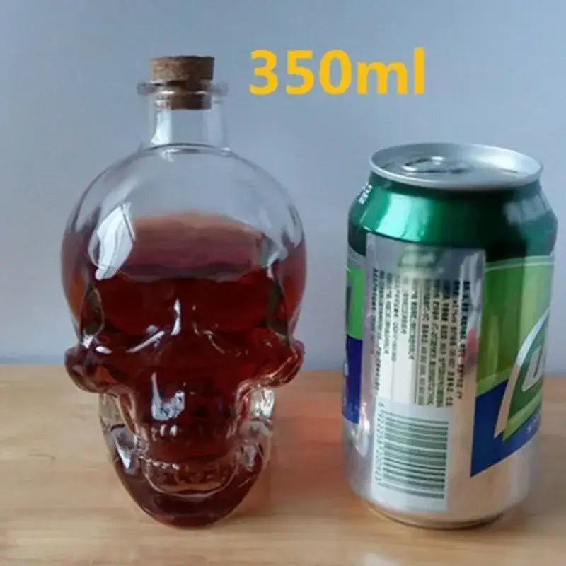 Clear glass skull bottle with cork stopper filled with dark red liquid for kitchen crystal wine and vodka decanter