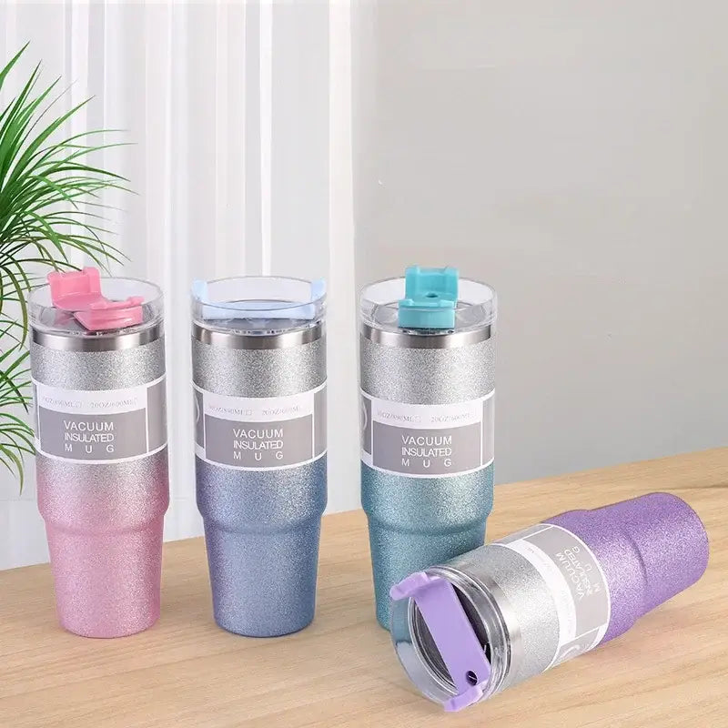 Three glitter pink blue and teal stainless steel double wall insulated water bottle mugs with silver bands and flip lids