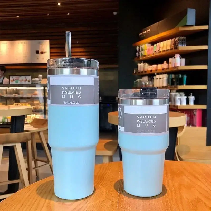 Light blue stainless steel double wall insulated vacuum mugs with silver lids and clear straw holders kitchen use