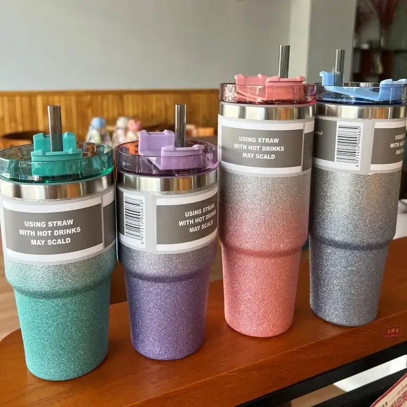 Glitter pink blue and teal stainless steel double wall insulated water bottle with metallic lids and straws in teal purple rose gold and silver