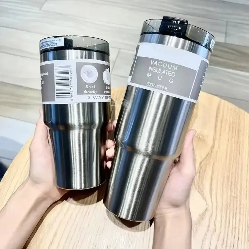 Silver stainless steel double wall insulated vacuum mug with black lid and clear plastic sleeve for water bottle use