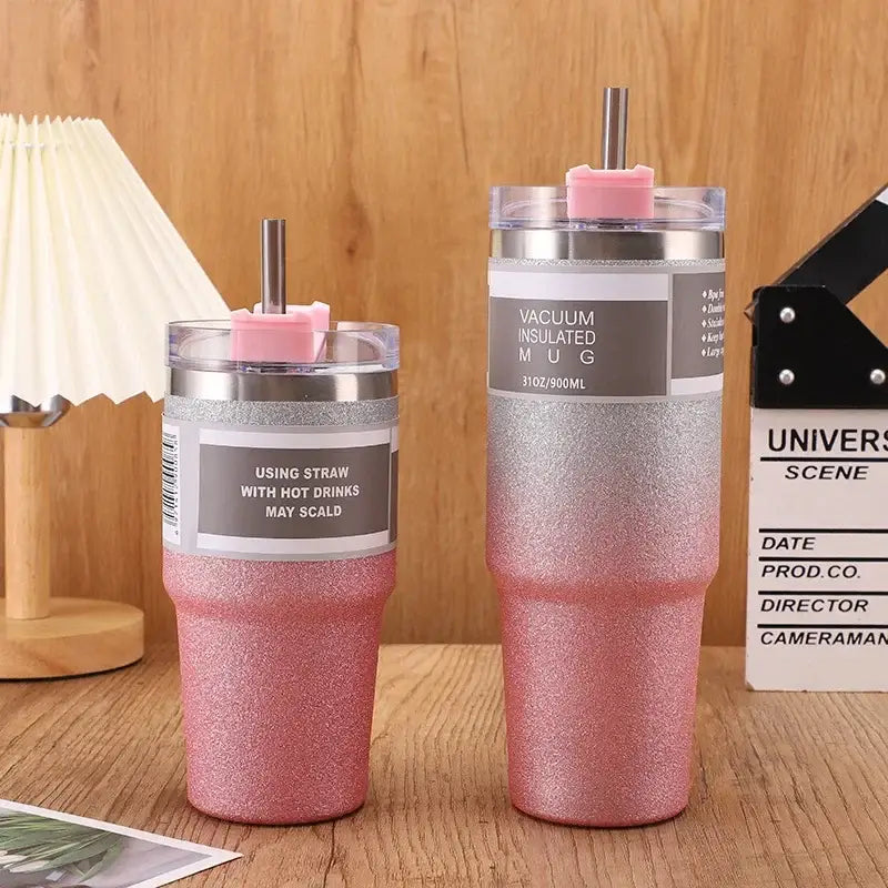 Pink glitter-finish stainless steel double wall insulated water bottle with silver rim and pink straw lid for kitchen use