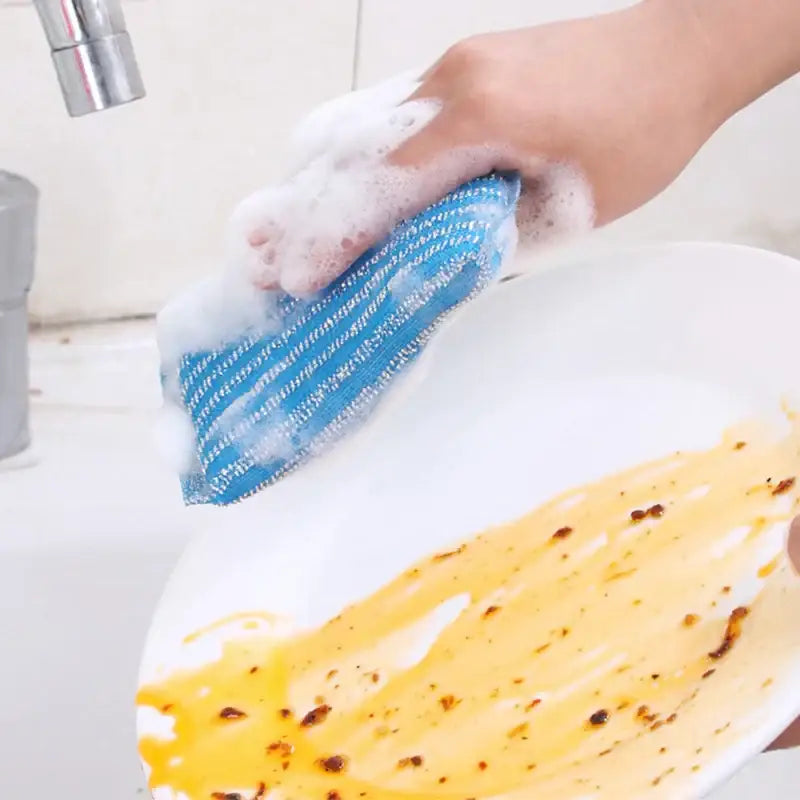 Blue striped dish scrubber with textured abrasive surface for effective cleaning in decorbites kitchen cleaning set
