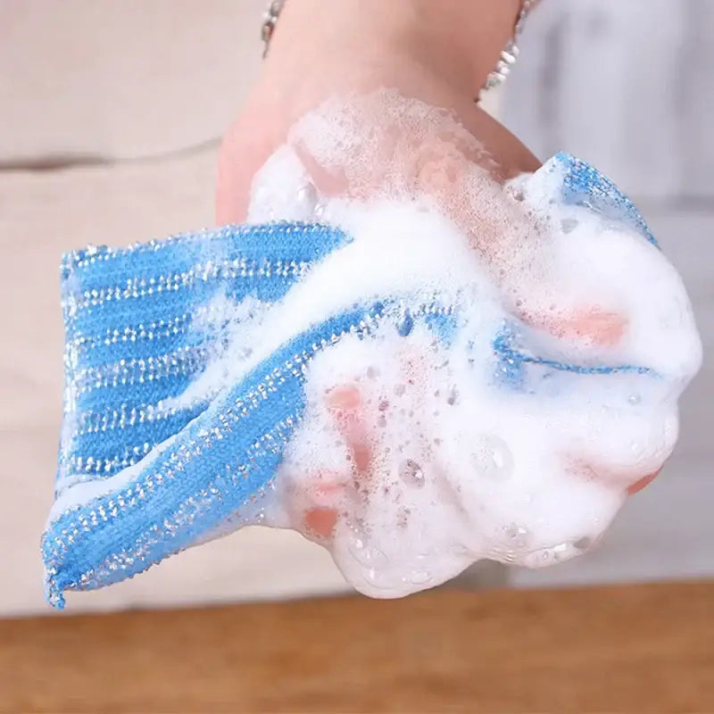 Blue textured sponge with striped pattern and white suds from decorbites kitchen cleaning set scrubbers