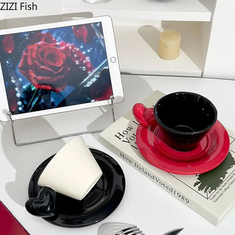 Glossy black and red ceramic heart shape lovers mug set with matching porcelain saucers for dining room use