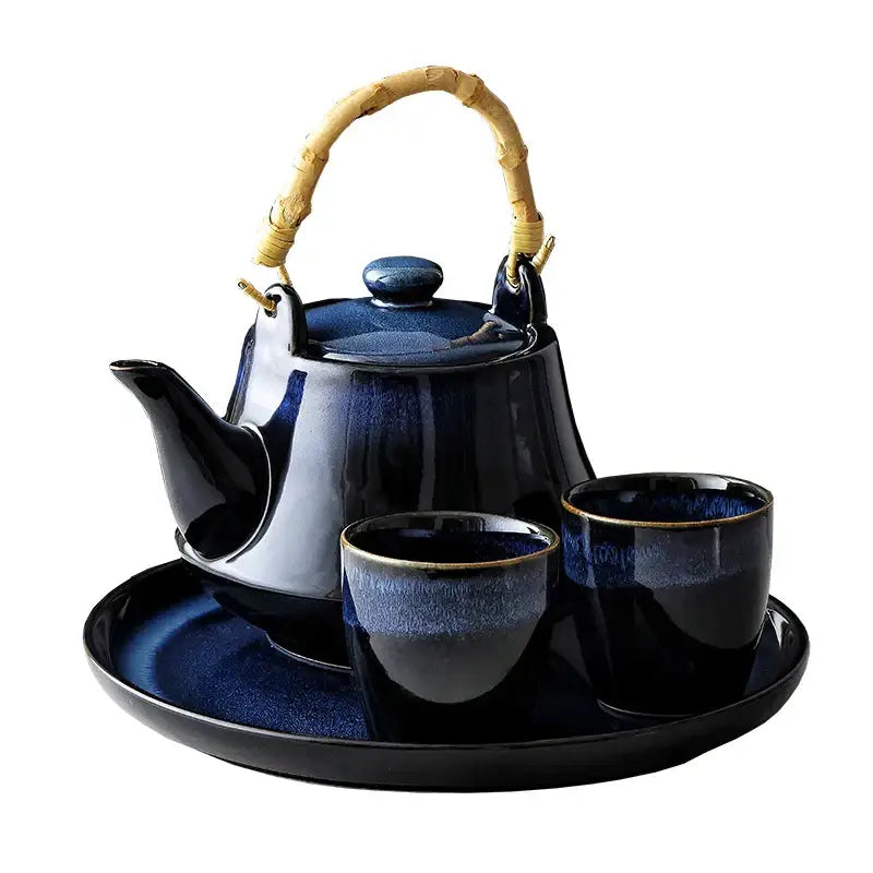 Glossy blue ceramic tea kettle set with bamboo handle and matching cups on coordinating tray for dining room decorbites blue ceramic