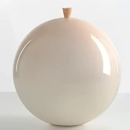 A smooth glossy beige ceramic vase with wooden knob shown alongside a colorful balloon ceiling lamp for kids bedroom