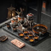 Glossy earth tone ceramic magnetic rotating tea set with intricate glaze and dark brown base decorbites dragon teapot