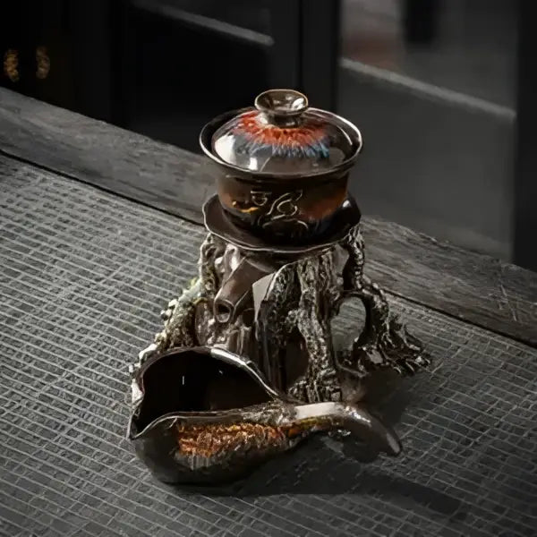 A dark ceramic dragon teapot with glossy earth tones and metallic accents featuring magnetic rotating tea function