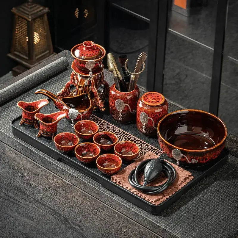 Red ceramic magnetic rotating tea set with silver leaf patterns on black tray decorbites dragon teapot design