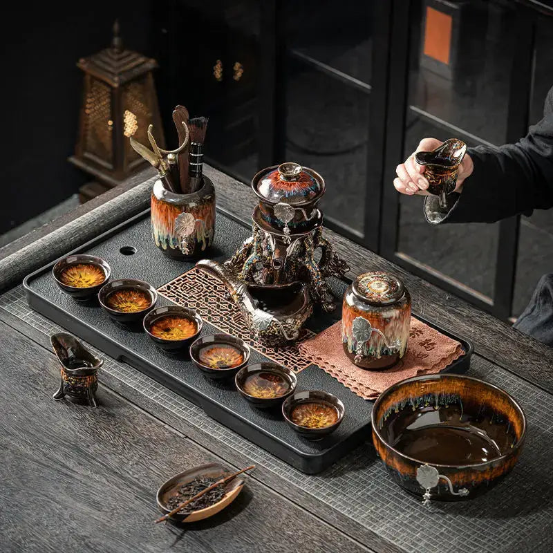 Dark ceramic magnetic rotating tea set with glossy earth tone glaze and decorbites dragon teapot patterns