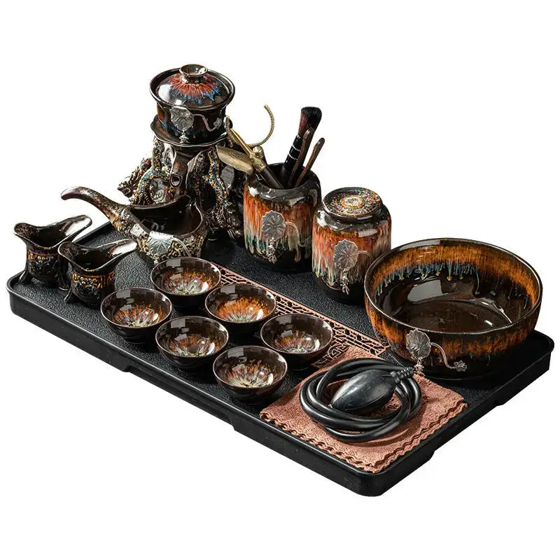 Elegant black ceramic magnetic rotating tea set with gold orange glaze featuring decorbites dragon teapot on tray