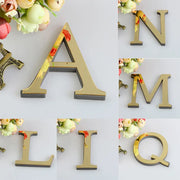 Glossy gold decorbites 3d mirror alphabet letters with dark gray base for living room wall decor