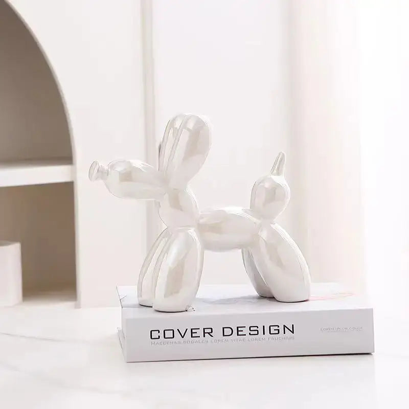 Shiny white ceramic balloon dog figurine resembling a glossy iridescent silver and gold 22cm balloon dog for decor